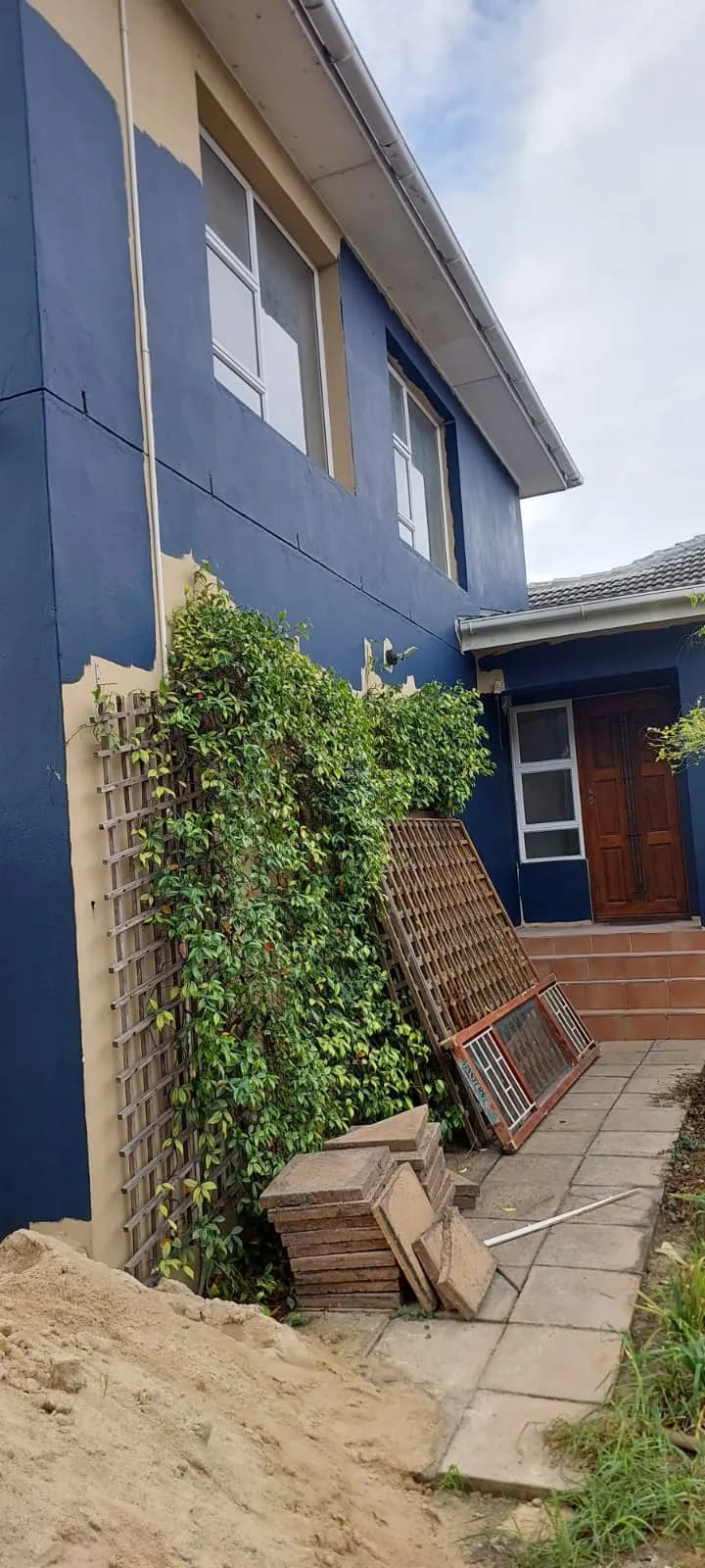 Navy blue exterior walls after a full repaint