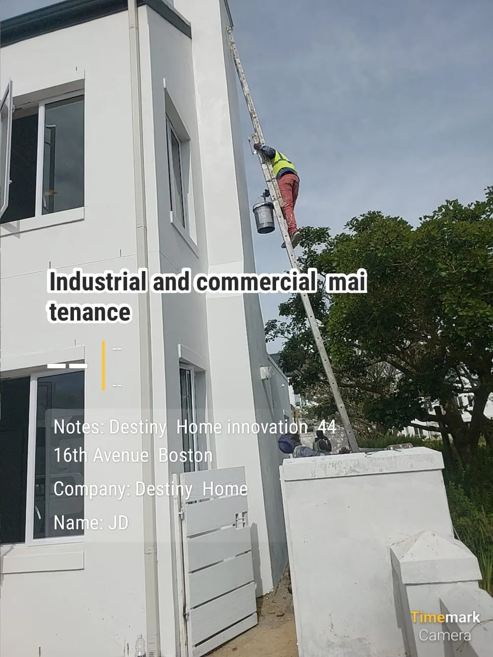 Destiny Home Innovation painter at work on a gable wall